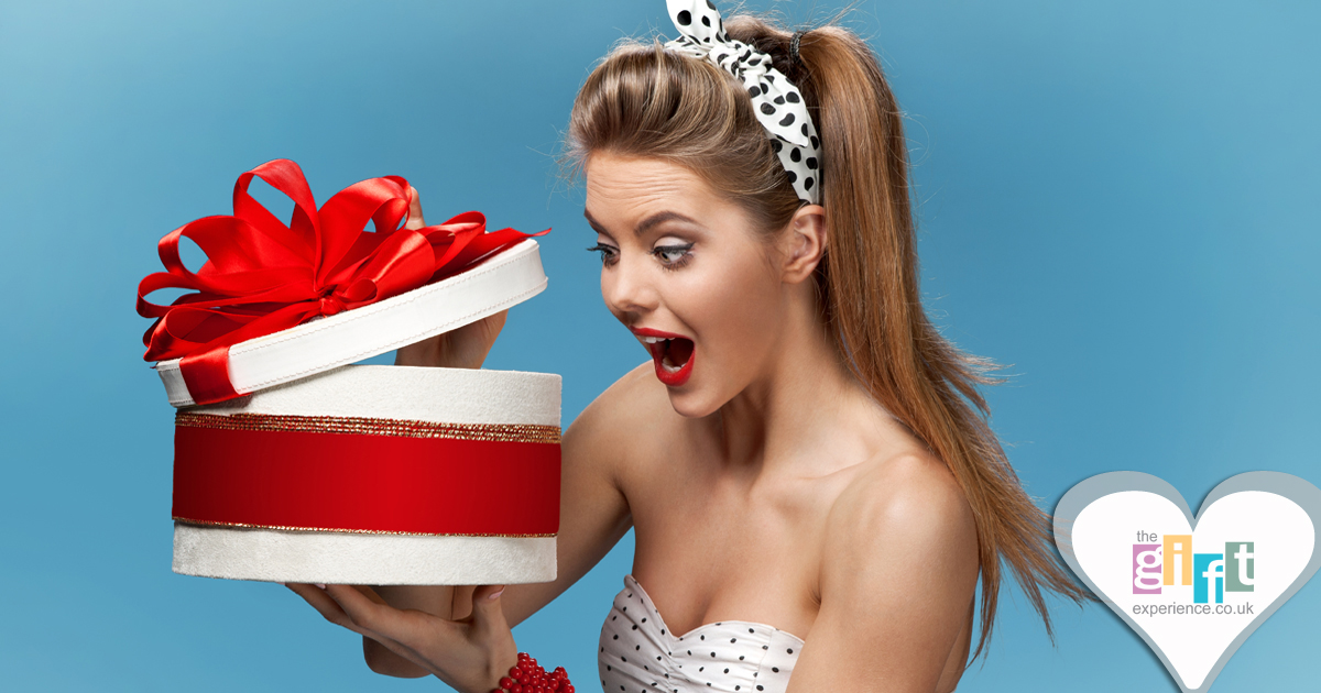 woman looking into a gift box