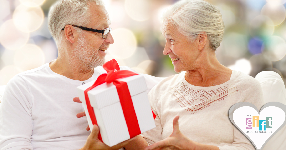 a couple celebrating their anniversary by exchanging gifts
